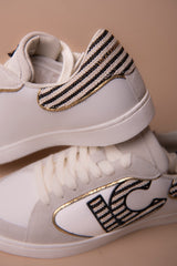 Deportiva con logo en tejidos combinados y detalles en piel