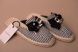 Flat sandal with raffia-effect sole in striped canvas fabric and bow detail