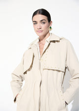 Trench coat with studded detail