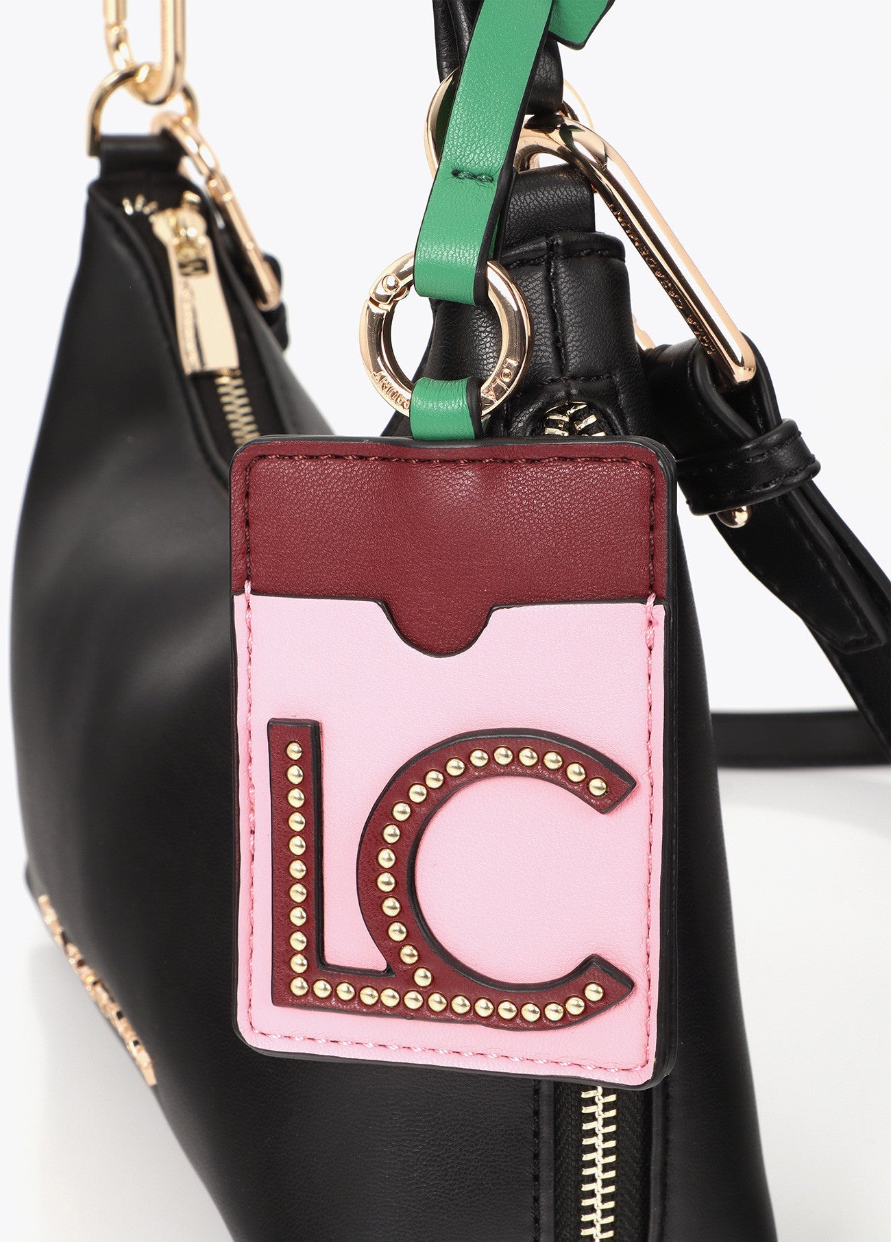 Faux leather shoulder bag with contrasting pendant