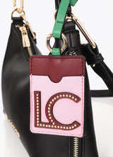 Faux leather shoulder bag with contrasting pendant