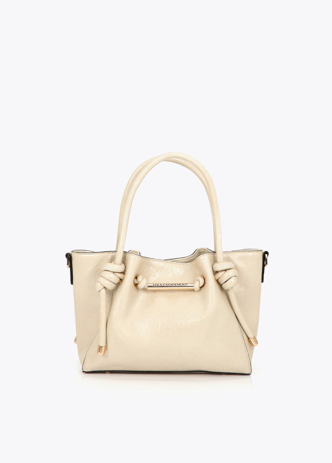 Crossbody bag with metal tube detail with die-cut logo
