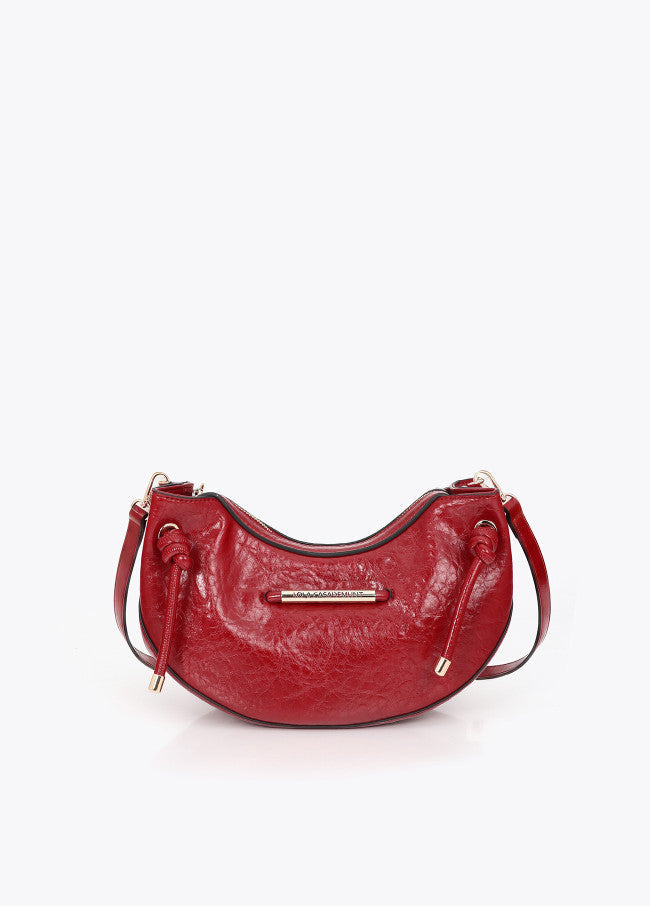 Half-moon shoulder bag with metallic tube detail with die-cut logo