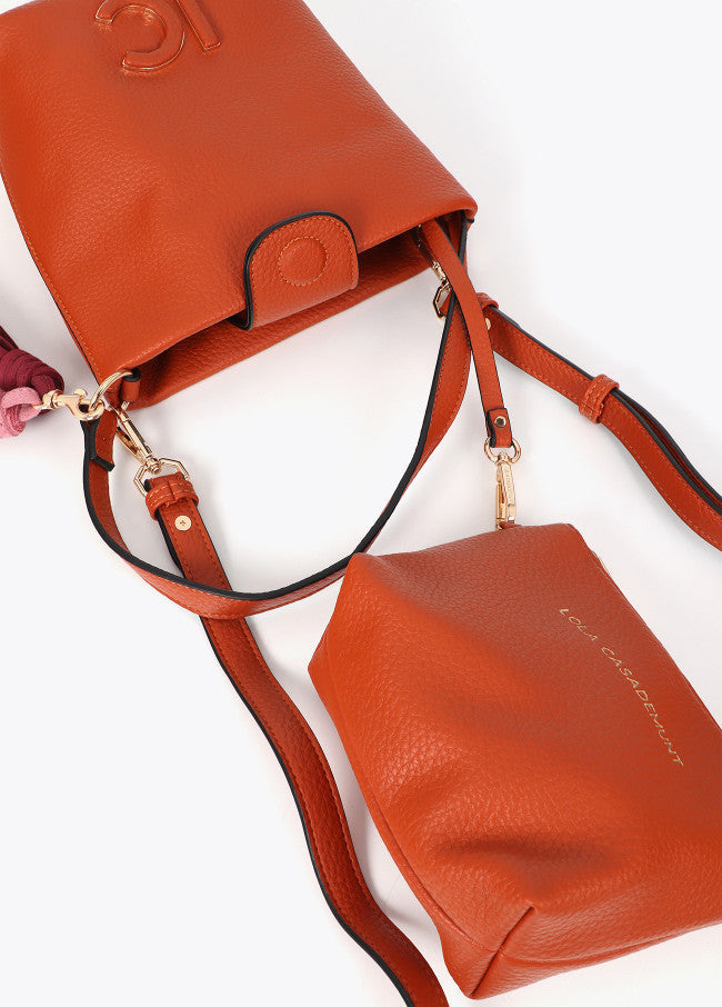 Faux leather shoulder bag with pompoms