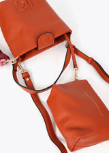 Faux leather shoulder bag with pompoms
