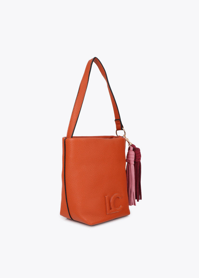 Faux leather shoulder bag with pompoms