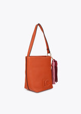 Faux leather shoulder bag with pompoms