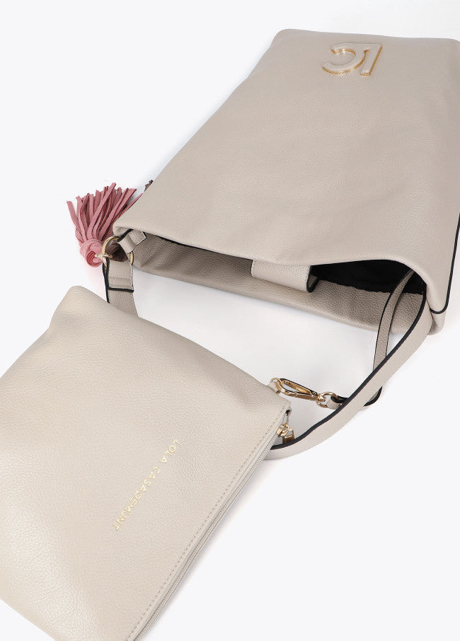 Leather-effect shopper with logo detail on the handle and pompoms