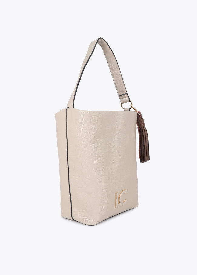 Leather-effect shopper with logo detail on the handle and pompoms