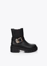 Flat ankle boot with strap detail and leopard buckle
