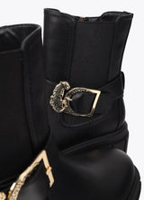 Flat ankle boot with strap detail and leopard buckle