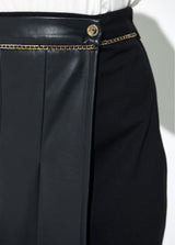 Combined skirt in leather effect and roma knit, pleats, midi length and chain at waistband