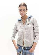 Short zip-up hoodie in denim, pins on the front