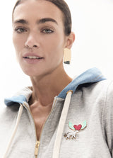 Short zip-up hoodie in denim, pins on the front