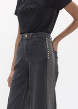 Long straight denim with two-tone side piece and studs on the sides