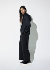 Jogger pants with contrasting piping on the sides of the leg.