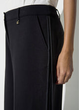 Jogger pants with contrasting piping on the sides of the leg.