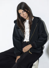 Jogger pants with contrasting piping on the sides of the leg.