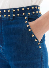 Flared denim with studs on waistband and front pockets