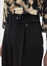 Long palazzo trousers with flower detail at the waist