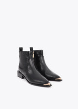 Cowboy-style ankle boots with studs and metal bracelet