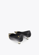 Shoe with jewel appliqué detail and metallic heel