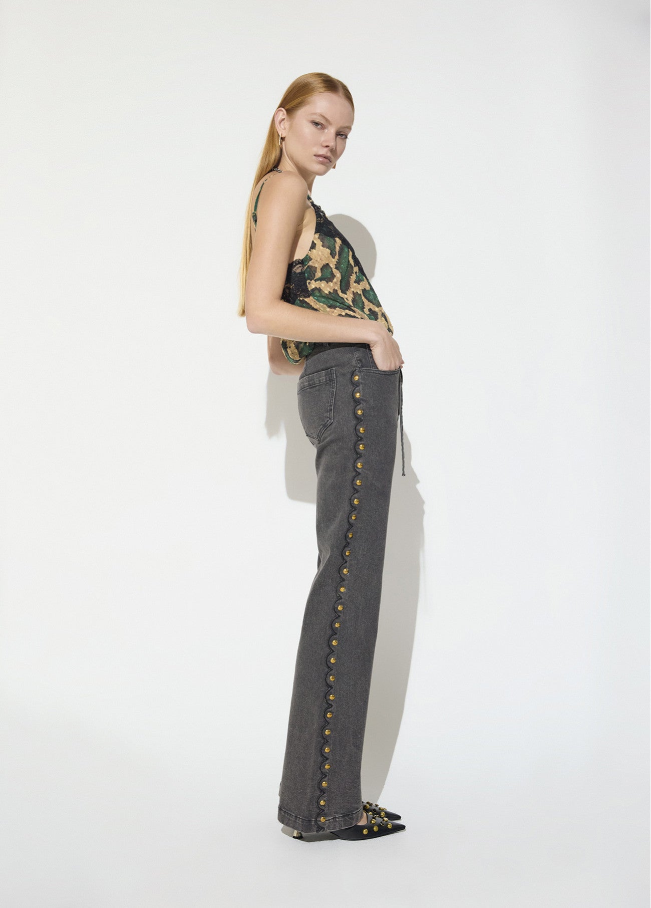 Long straight jeans with studded side detail and belt with custom buckle
