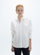 Oversized shirt with gold studs with positioned drawings