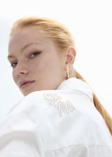 Oversized shirt with gold studs with positioned drawings