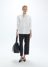 Oversized shirt with gold studs with positioned drawings