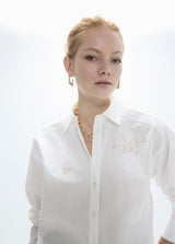 Oversized shirt with gold studs with positioned drawings